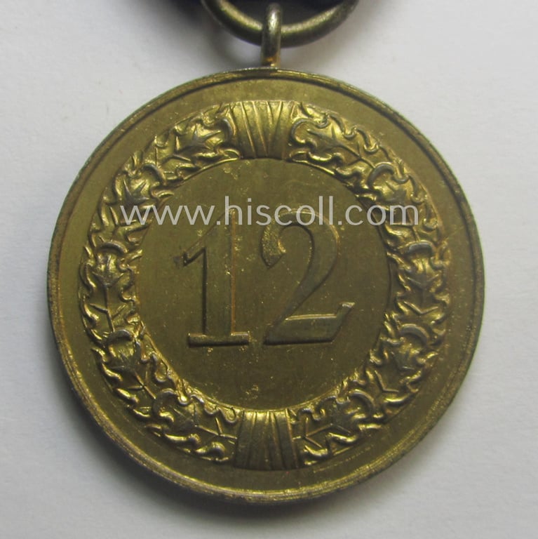 WH (Heeres o. KM) bright golden-toned 'WH-DA der 3. Klasse für 12 Jahre Dienstzeit' that comes mounted onto its accompanying ribbon (ie. 'Bandabschnitt') having a golden-toned eagle-device attached