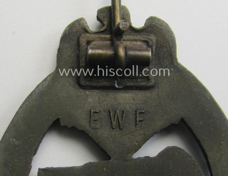 Attractive, 'Panzerkampfabzeichen in Bronze' (or: bronze panzer-assault badge or PAB) being a maker- (ie. 'EWE'-) marked- and/or zinc- (ie. 'Feinzink'-) based example (that comes in an overall very nice and only minimally used- ie. worn conditi...