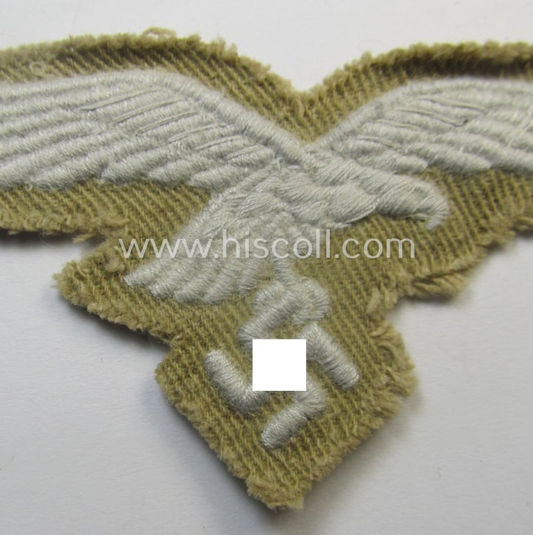 Moderately- ie. hardly used - and actually very scarcely found! - WH (Luftwaffe) 'tropical'-issued- (ie. DAK or 'Deutsches Afrika Korps'-related) EM- ie. NCO-type breasteagle as was specifically intended for usage on the tropical-tunics