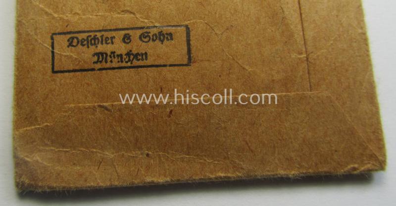 Medal-set: 'Deutsches Schutzwall Ehrenzeichen' (aka: 'Westwall'-medal) being a non-maker-marked- and/or: typical 'Buntmetall'-based specimen that comes packed in its original pouch of issue by the: 'Deschler & Sohn'-company