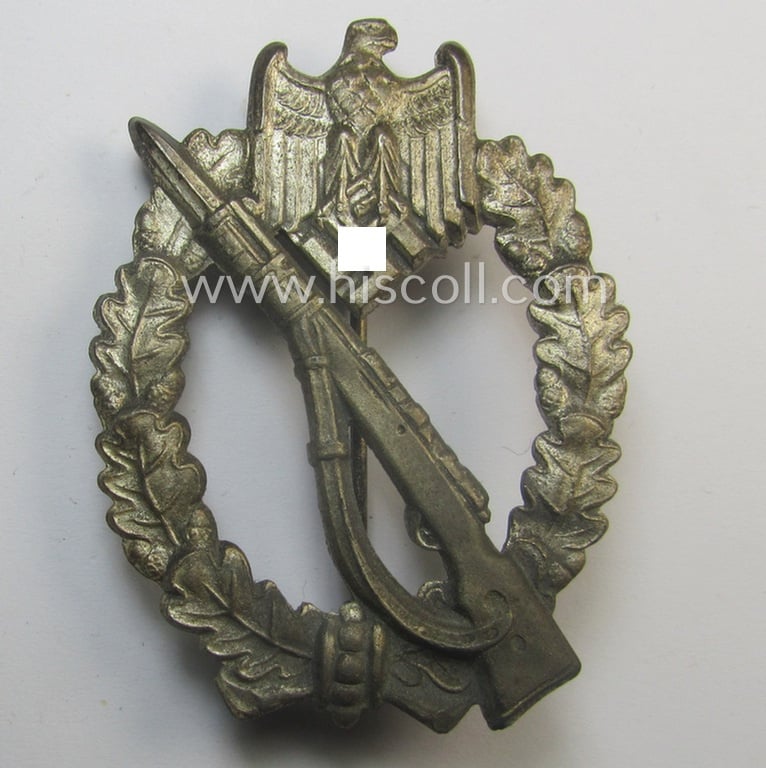 Attractive, 'Infanterie Sturmabzeichen in Silber' (or: silver-class infantry assault-badge ie. IAB) being a maker- (ie. 'ÜÜ'- ie. 'E.F. Wiedmann') marked so-called: 'Lily Pad-hinge'-example that comes stored in its period box