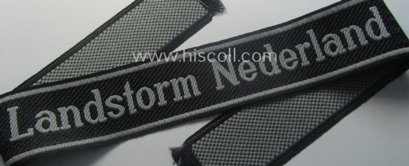 Waffen-SS, 1943/44 pattern cuff-title (ie. 'Ärmelstreifen') depicting the machine-woven Latin script text in silver-grey linnen as was intended for a member of the: '34. SS-Freiwilligen-Grenadier-Division': “Landstorm Nederland”