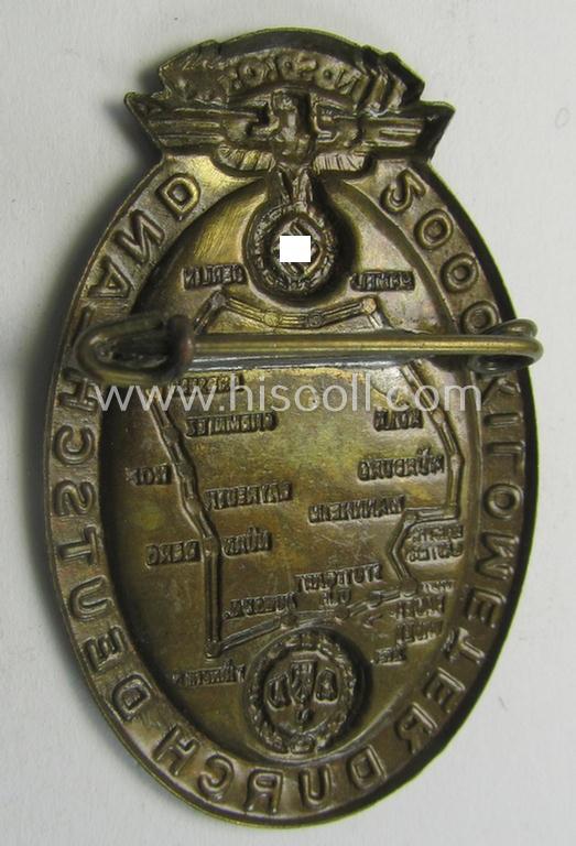Commemorative - golden-bronze-toned- and fairly unusually seen! - N.S.K.K.-related 'tinnie' being a non-maker-marked example depicting an illustration of an N.S.K.K.-logo and map of Germany coupled with the text: '2000 Kilometer durch Deutschland...