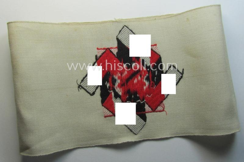 Attractive, beige-white-coloured and typical linnen-based so-called: TeNo (ie.: 'Technische Nothilfe') 'Amtsträger'-armband depicting the typical 'TeNo'-logo (with TN-lettering) and that comes in a just minimally used- ie. worn, condition