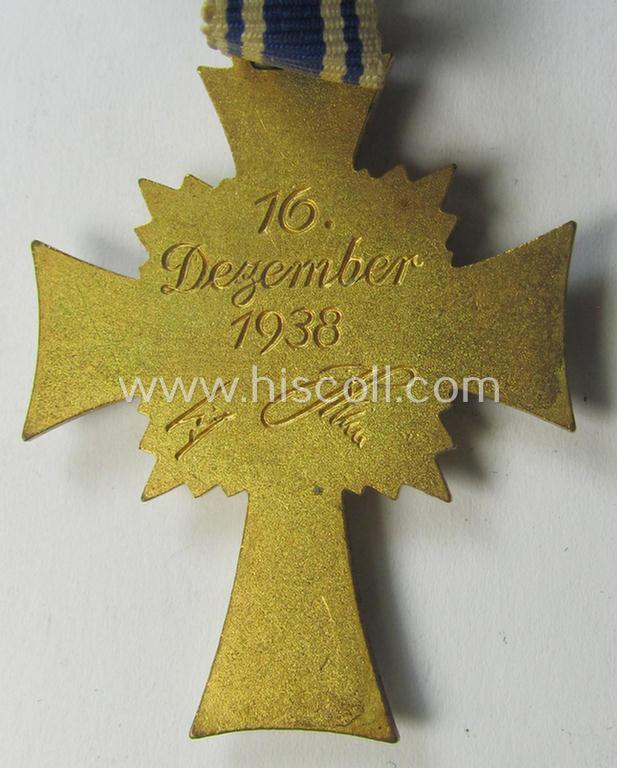 Attractive, 'Ehrenkreuz der deutschen Mutter - erste Stufe' (or: golden-class mothers'-cross) being a hardly used  example that comes mounted onto its accompanying, long-sized ribbon as issued and/or recently found