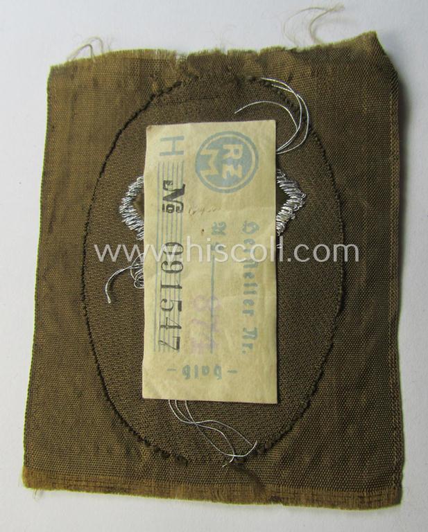 Attractive - and rarely encountered! - SA- (ie. 'Sturmabteilungen'-) related officers'-type armbadge (ie. 'Ärmelabzeichen für Führer') as was intended for an: 'SA-Führer' (ie. 'Feldscher o. Arzt') that retains its period 'RzM'-etiket