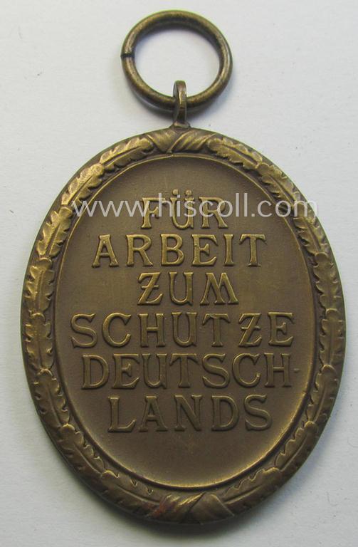 Medal-set: 'Deutsches Schutzwall Ehrenzeichen' (aka: 'Westwall'-medal) being a non-maker-marked- and/or: 'Buntmetall'-based specimen that came together with its period- (and neatly folded ie. non-confectioned) ribbon (ie. 'Bandabschnitt')