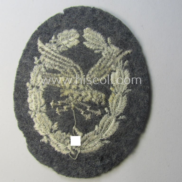 WH (Luftwaffe) so-called: 'Fliegerschützen-Abzeichen mit Blitzbündel in Stoff' (or: cloth air-gunners-badge with lightning-bolts) being a nicely executed and typical machine-embroidered specimen