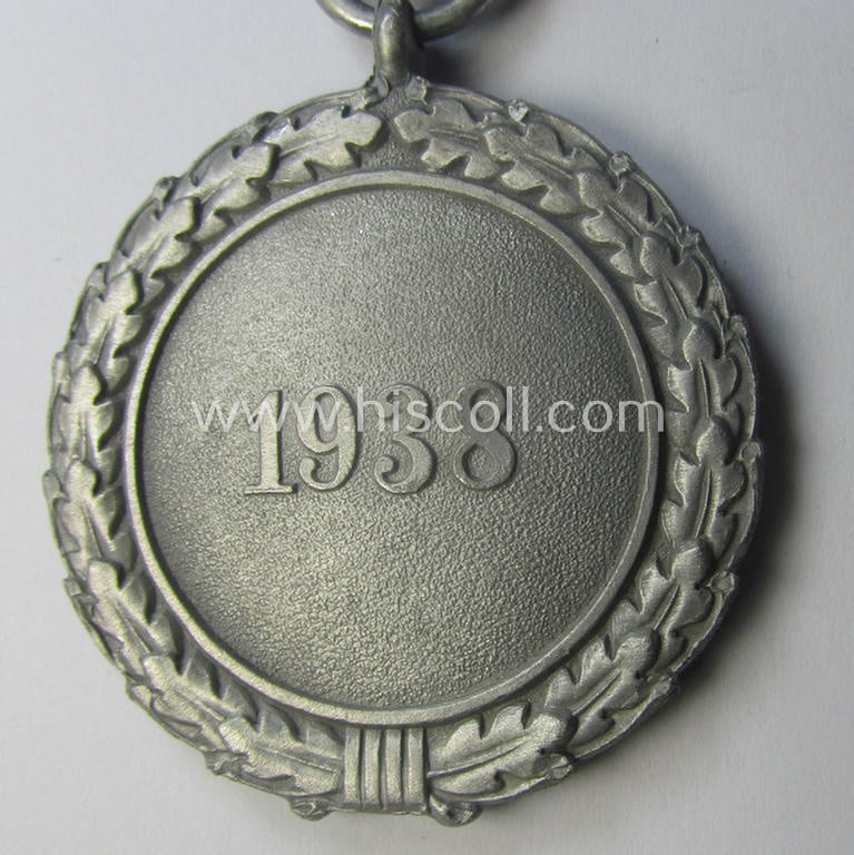 'Luftschutz-Ehrenzeichen 2. Stufe' being a non-maker-marked example as executed in (light-weight) aluminium-based metal and that comes mounted onto its period (confectioned) ribbon ie. 'Bandabschnitt'