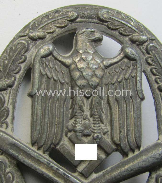'Allgemeines Sturmabzeichen' (or: General Assault Badge ie. GAB) being a typical unmarked, zinc-based- (ie. 'Feinzink'-) and/or: 'flat-back'-version as was (I deem) produced by the: 'Rudolf Karneth'-company