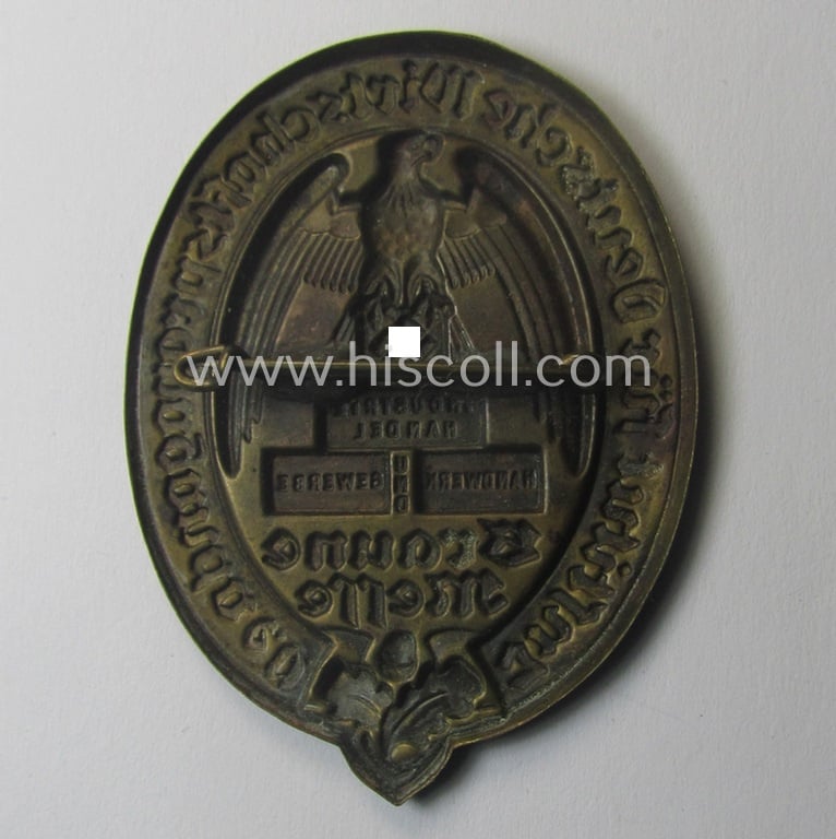 Unusual, bronze-toned- (ie. I deem 'Feinzink'- ie. pot-metal-) based: N.S.D.A.P.-related day-badge (ie. 'tinnie' or: 'Veranstaltungsabzeichen') entitled: 'Institut für Deutsche Wirtschaftspropaganda e.V. - Braune Messe'