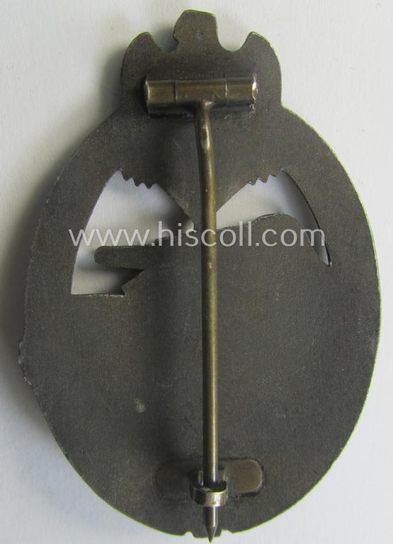 'Panzerkampfabz. in Bronze' (or: bronze-class panzer assault-badge or PAB) being a zinc- (ie. 'Feinzink'-) version (having a so-called: 'horizontal'-catch-set-up) as was (presumably) procuced by the: 'Fritz Zimmermann'-company