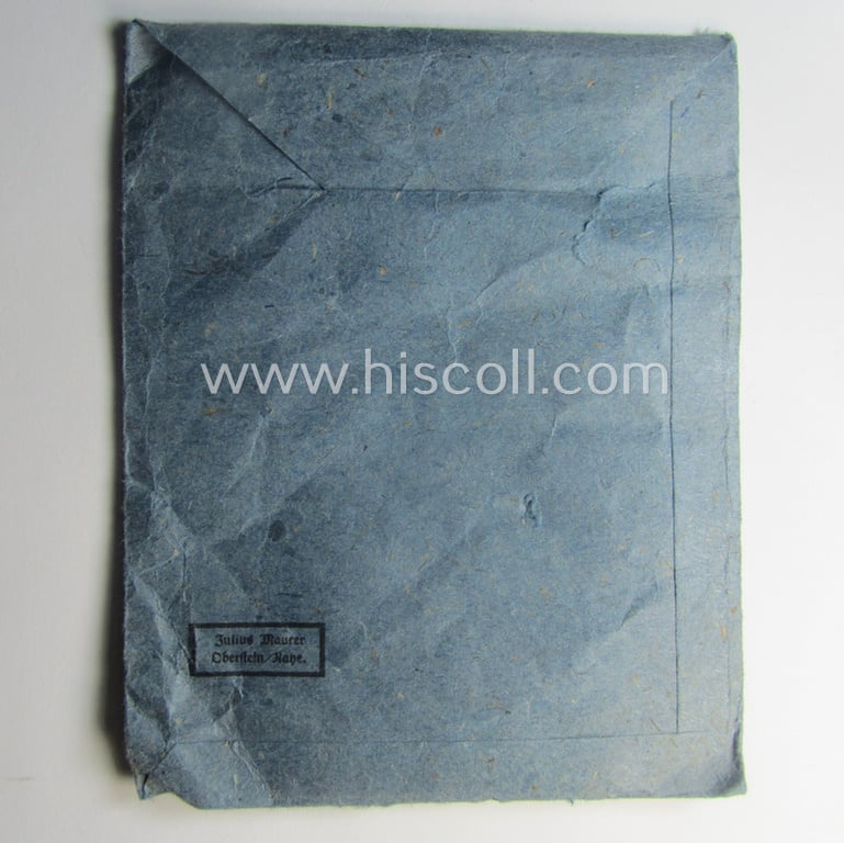 Superb - and very rarely found! - 'Eisernes Kreuz 2. Kl.' (ie. Iron Cross 2nd Class) being a maker- (ie. '75'-) marked example that comes stored in its period 'Zellstoff'-based pouch by the: 'Julius Maurer'-company