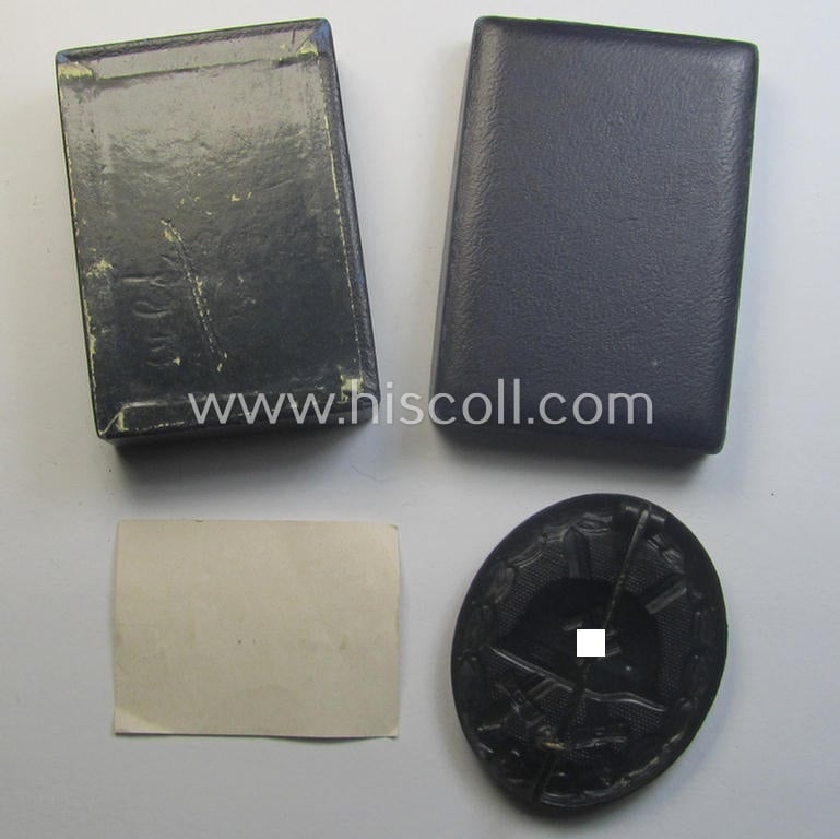'Verwundeten-Abzeichen in Schwarz' being a maker- (ie. 'L/53'-) marked example by the company: 'Hymmen & Co.' and that came stored in its typical 'LDO'-type etui (ie. two-pieced-box)