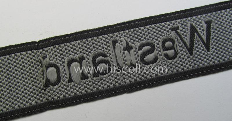 Waffen-SS, 1943/44 pattern cuff-title (ie. 'Ärmelstreifen') depicting the machine-woven Latin script text in silver-grey linnen as was intended for a member of the: 'SS-Regiment "Westland" (ie. part of the: '5. SS-Pz-Gren.-Div. "Wiking")