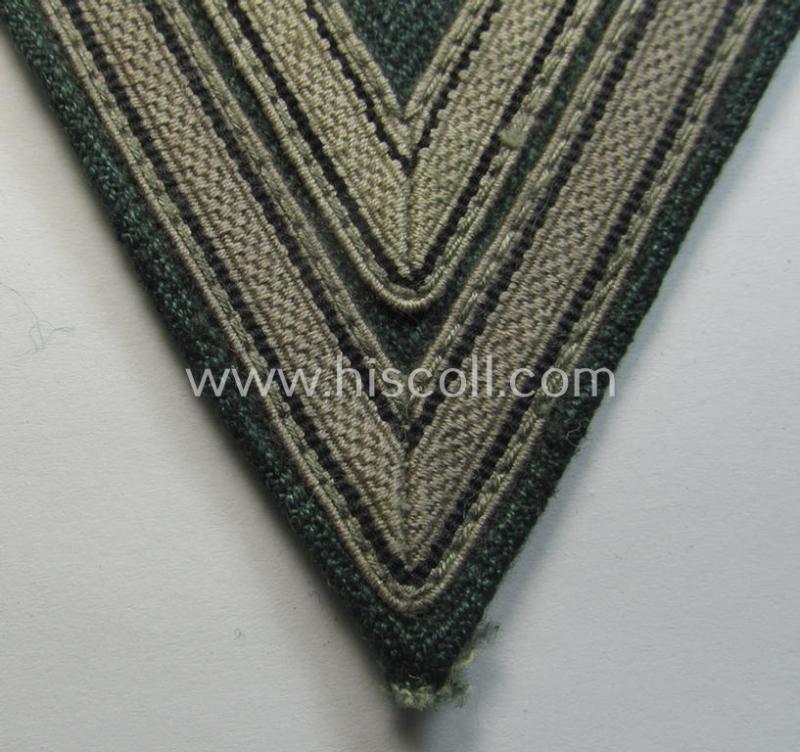 Neat, WH (Heeres ie. Waffen-SS) 'Armwinkel' (or: arm-chevron) as was executed on a greenish-coloured- and/or 'HBT'-like (ie. 'Drillich'-) based background as was specifically intended for usage by an: 'Obergefreiter' (ie. 'SS-Rottenführer')