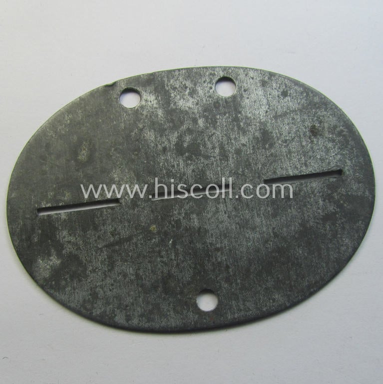 Zinc-based, WH (Luftwaffe) ie. 'LW-Flak-Artillerie'-related ID-disc (ie. 'Erkennungsmarke') bearing the stamped unit-designation that simply reads: '2. Flak 24' and that comes as issued- and/or worn