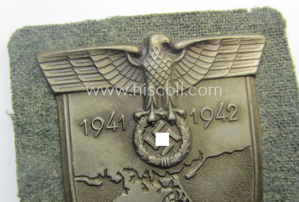 Simply never used ie. 'mint', WH (Heeres ie. Waffen-SS) 'Krim'-campaign-shield (as was I deem produced by maker: 'Wilh. Deumer') and that comes in a wonderful and/or fully untouched, condition