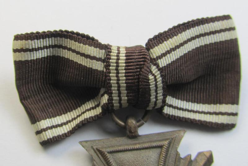 Superb, 'N.S.D.A.P. Dienstauszeichnung in Bronze' (ie. being of the '3. Stufe für 10 Jahre treue Dienste') being a non-maker-marked- (and 'heavy-weight'!) example that comes mounted onto its female-related ribbon (ie. 'Bandabschnitt')