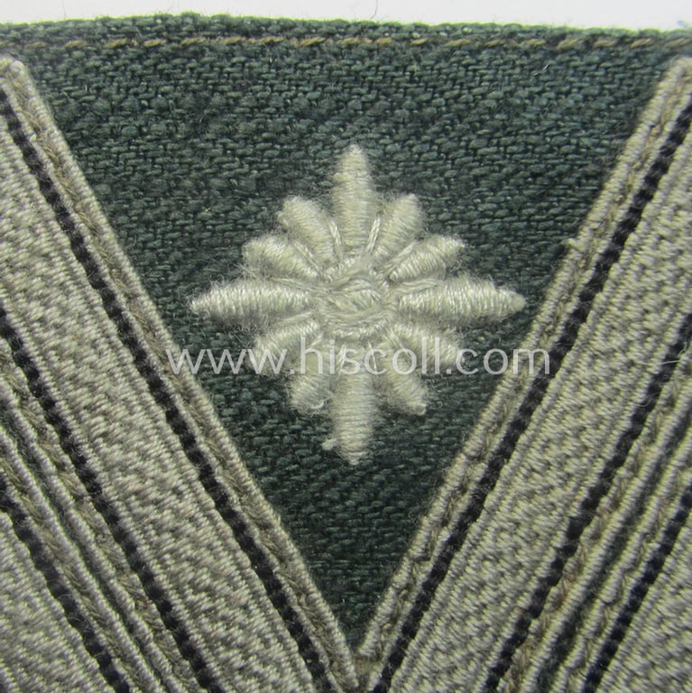 WH (Heeres) 'Armwinkel' (or: arm-chevron) as was executed on a greenish-coloured- and/or 'HBT'-like (ie. 'Drillich'-) based background as was specifically intended for usage by a soldier with the (unusually encountered!) rank of a: 'Stabsgefreiter'