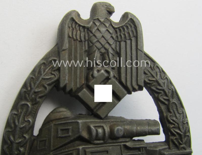 Attractive, 'Panzerkampfabzeichen in Bronze' (or: bronze panzer-assault badge or PAB) being a maker- (ie. 'EWE'-) marked- and/or zinc- (ie. 'Feinzink'-) based example (that comes in an overall very nice and only minimally used- ie. worn conditi...