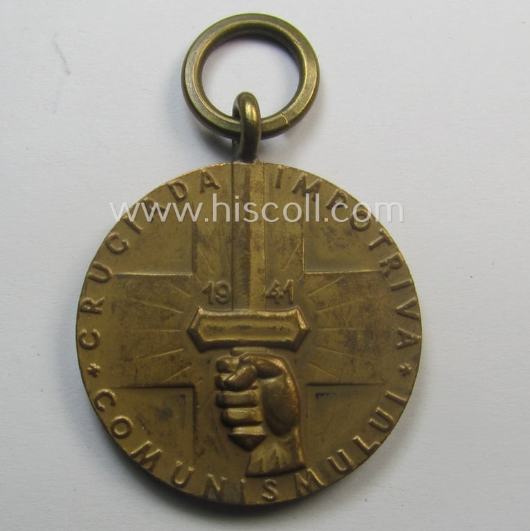 Romanian medal: 'Kreuzzug gegen den Kommunismus' (or in Romanian language: 'Medalia - Crusiada Impotriva Communismului') that comes together with its original (and never confectioned- ie. 'virtually mint') ribbon as issued