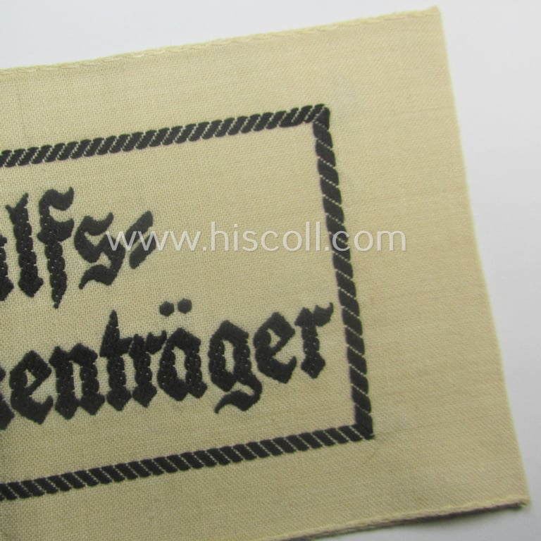 Beige-white-coloured- and/or linnen-based armband (ie. 'Armbinde') as was executed in the 'thicker-styled' fabric as was intended for WH (Heeres) staff-members working as: 'Hilfs-Krankenträger'