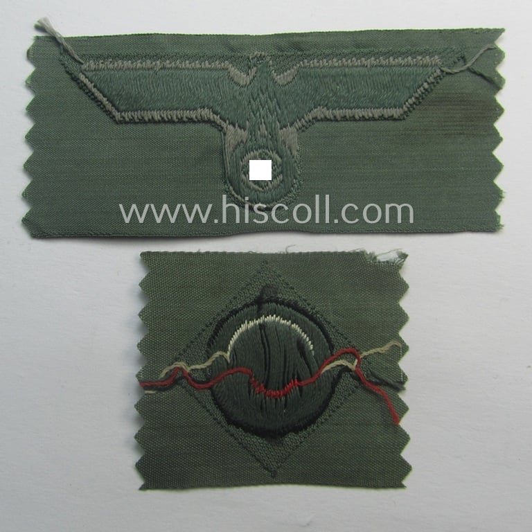 Early- (ie. mid-) war-period, WH (Heeres) cap-eagle & cocarde-set (ie. 'Schiffchenmützen-Adler u. Kokarde-Satz für Mannschaften u. Uffz.') being a 'virtually mint' set as executed in bluish-grey-coloured linnen on a field-grey-coloured background
