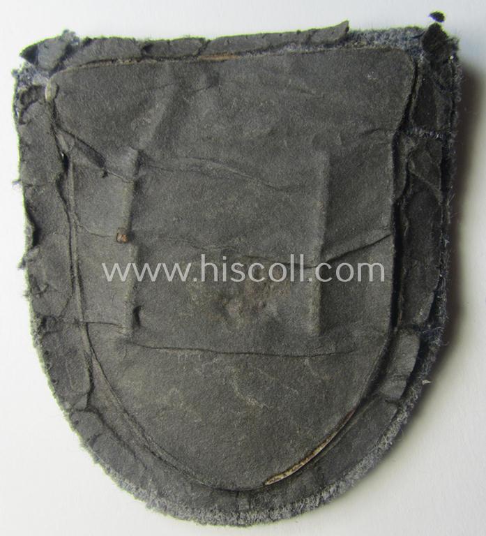 WH (Luftwaffe) 'Krim'-campaign-shield that comes mounted onto its original, bluish-grey-coloured 'backing' and that comes in a surely issued-, minimally worn and/or (I deem) carefully tunic-removed-, condition