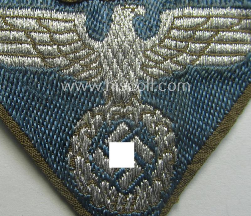 SA-related cap-eagle as was intended for the: 'Lagermütze' (ie. side-cap) being an example as woven on a bright-blue-coloured background and as such intended for members within the: 'SA-Gruppe Warthe o. Oberrhein'