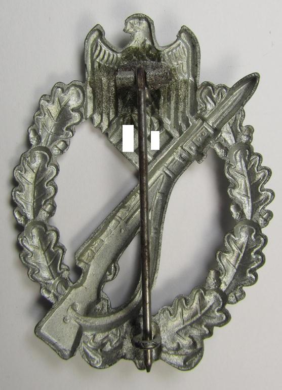 'Infanterie Sturmabzeichen in Silber', being an unmarked (and/or very converse- ie. vaulted-) 'hollow-back' example by the maker: 'Friedrich Linden' (ie. 'F.L.L.') as was executed in silver-coloured, zinc-based metal (ie. 'Feinzink')