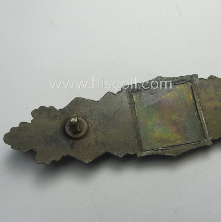 'Nahkampfspange in Bronze' (or: bronze-class close-combat clasp ie. CCC) being a (typical) non-maker-marked- and/or minimally converse-shaped specimen as was (I deem) produced by the maker- (ie. 'Hersteller') 'Steinhauer & Lück'