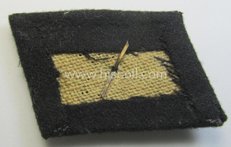 Waffen-SS NCO-pattern rank-collar-rank-tab ('Kragenspiegel') being a 'standard-issue'-pattern example as executed in black-coloured wool as was intended for usage by an: 'SS-Unterscharführer'