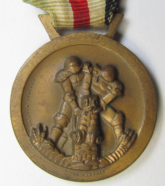 Superb, golden-bronze-coloured- (and I deem 'Buntmetall'-based-) example of a: 'Deutsch-Italienische Feldzugsmedaille' (or: German-Italian campaign medal) that comes mounted on its (regular-sized-) piece of original ribbon
