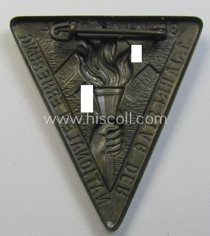 Commemorative, golden-bronze-coloured, N.S.D.A.P.-related 'tinnie' being a maker- (ie. 'Linden'-) marked example depicting a hand with a torch surrounded by the text: '1. Jahrestag der Nationalen Erhebung - 30. Jan. 1934'