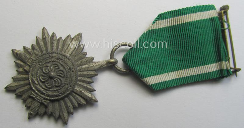 WH-related 'Tapferkeitsauszeichnung für Angehörige der Ostvölker, 2. Kl. in Silber mit Schwn.' (being a 'Feinzink'-based example that comes stored in its period pouch)