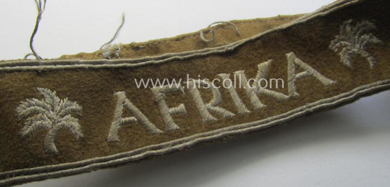 Attractive - and clearly worn! - WH cuff-title (ie. 'Ärmelstreifen') entitled: 'Afrika' (being a minimally shortened example that comes in an overall very nice- (ie. issued and clearly worn ie. once tunic-attached-), condition)