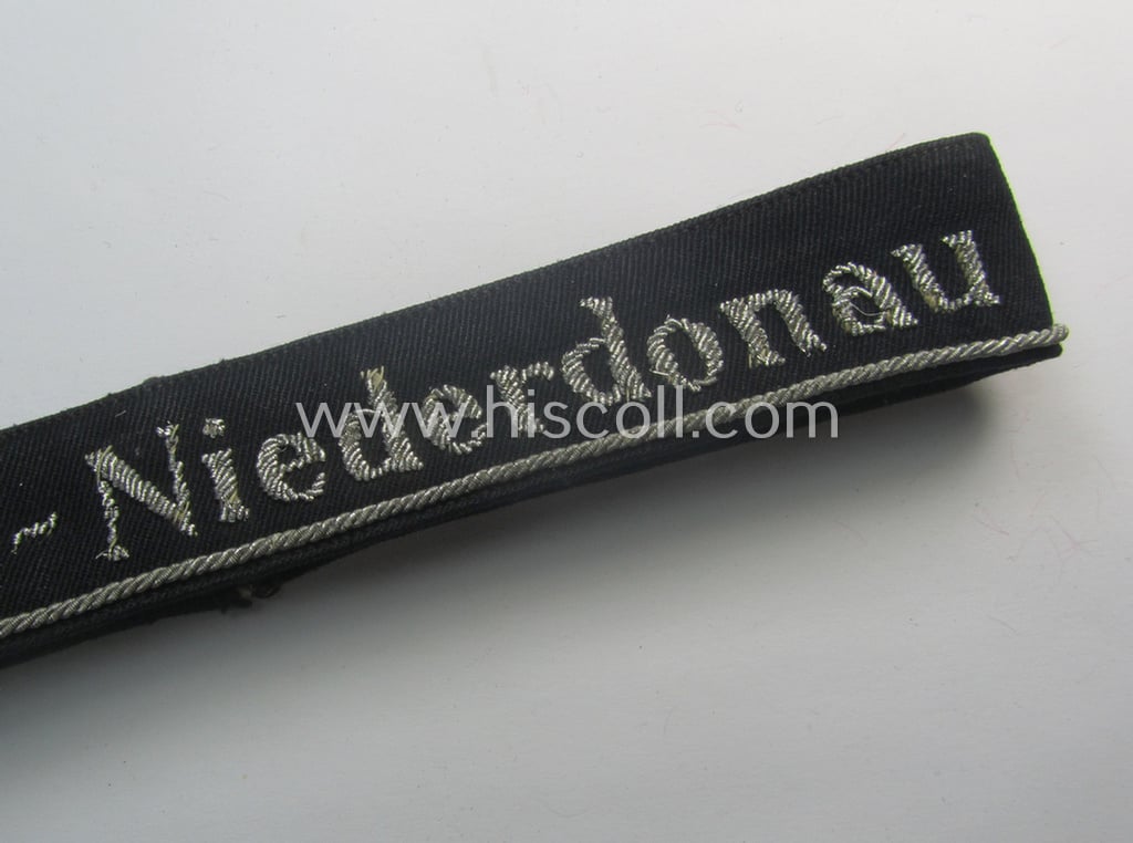 Stunning - and very rarely encountered! - example of a hand-embroidered BDM- (ie. 'Bund deutscher Mädel') officers'-pattern cuff-title (ie. 'Ärmelstreifen für Führerinnen der Bund deutscher Mädel') entitled: 'Südost-Niederdonau'