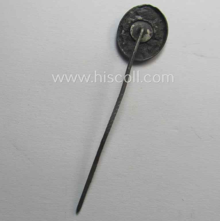 Neat - and 17 mm. sized! - miniature lapel-pin (ie. 'Halbminiatur') depicting a: 'Verwundeten-Abzeichen in Schwarz' (or: black-class wound-badge) being a non-maker-marked example