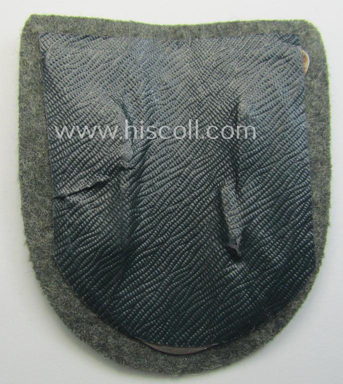 WH (Heeres ie. Waffen-SS) 'Krim'-campaign-shield (by the maker: 'Friedrich Orth') that comes stored in its period (and rarely seen!) 'Zellstoff'-based pouch and that comes in a probably issued- (albeit still 'virtually mint'-), condition