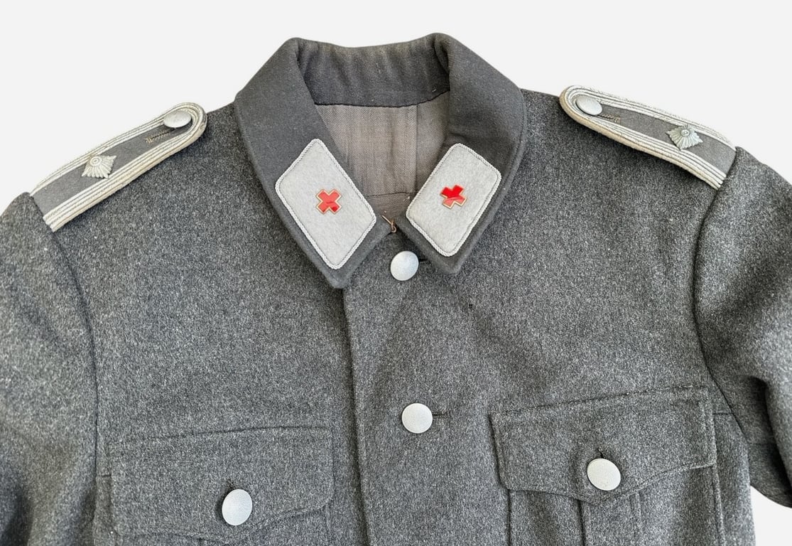 DRK (Deutsches Rotes Kreuz)  Vorhelfer service tunic with original insignia and armband.