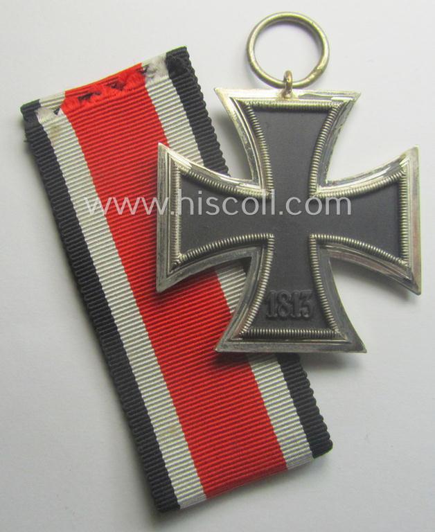 'Eisernes Kreuz II. Klasse' being a (typical) non-maker-marked example that comes together with its original- and never-mounted ribbon (ie. 'Bandabschnitt') as was produced by a (by me) unidentified maker (ie. 'Hersteller')