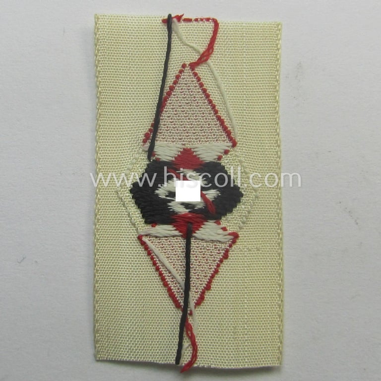 HJ (ie. 'Hitlerjugend') cap-badge (ie.: 'Raute') as executed in 'BeVo'-weave-pattern