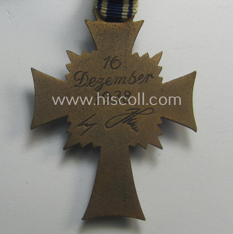 'Ehrenkreuz der deutschen Mutter - dritte Stufe' (or: bronze-class mothers'-cross) that came mounted onto its long-sized ribbon and that came stored in its period pouch by the maker: 'Louis Gottlieb - Oberstein a.d. Nahe'