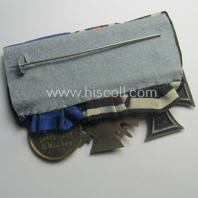 3-pieced, 'WWI'-period medal-bar (ie. 'Ordenspange') resp. depicting an: 'EK II.Kl.', a: 'FKK 1914-18 mit Schwn.' and a: 'Landwehr DA 2. Kl. 1913' that comes with its accompanying miniature 'Feldspange'