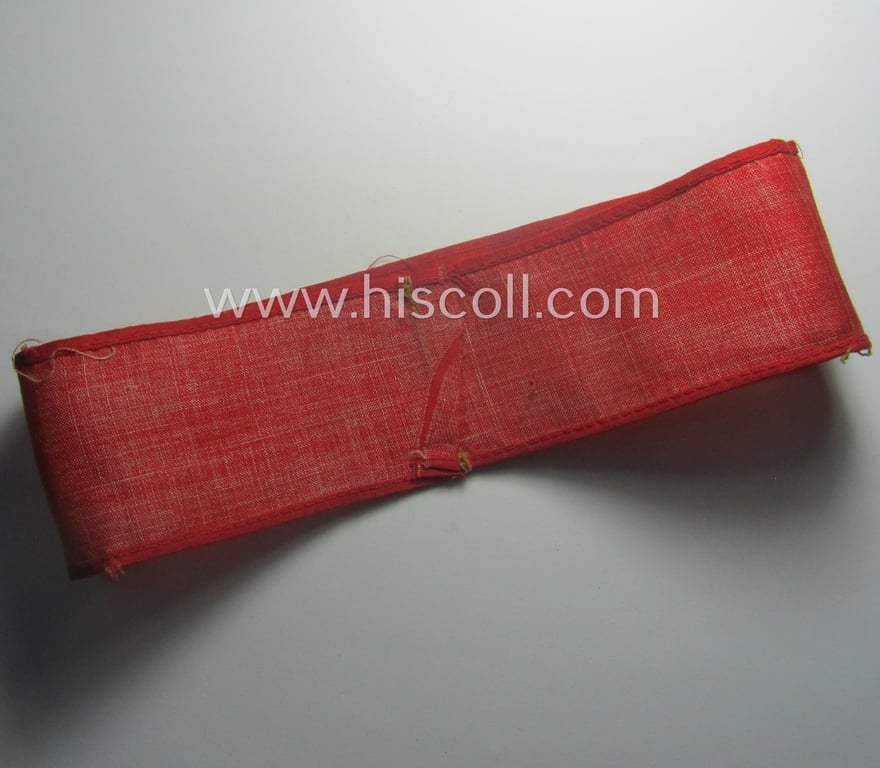 Truly worn, thin-shaped, 'N.S.D.A.P.'-related armband (ie. 'Armbinde') being of the 'entirely printed'-type showing a swastika-sign