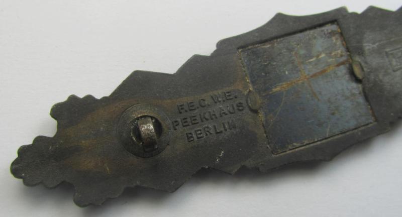 'Nahkampfspange in Bronze' (or: bronze-class close-combat clasp ie. CCC) being a neatly maker-marked- and/or minimally converse-shaped specimen as was produced by the: 'JFS'- (ie. 'Joseph Feix u. Söhne'-) company
