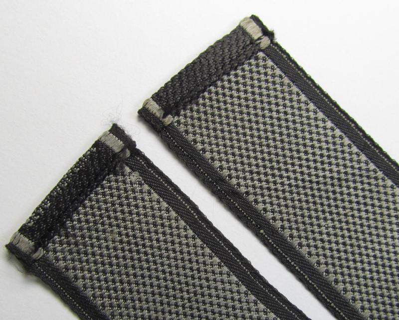 Stunning, Waffen-SS, 1943-pattern cuff-title (ie. 'Ärmelstreifen') depicting the machine-woven Latin script text in silver-grey linnen, as was intended for a member of the: 'SS-Regiment “Der Führer”