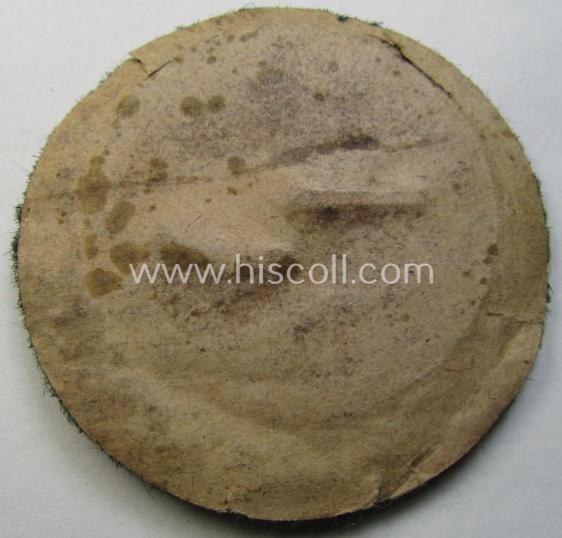 WH (Heeres- ie. Waffen-SS) so-called: 'Kraftfahrbewährungs-Abzeichen in Silber' (or: silver-class drivers' proficiency-badge) that comes mounted onto its piece of field-grey-coloured wool and that comes as probably issued- but never worn, conditio...