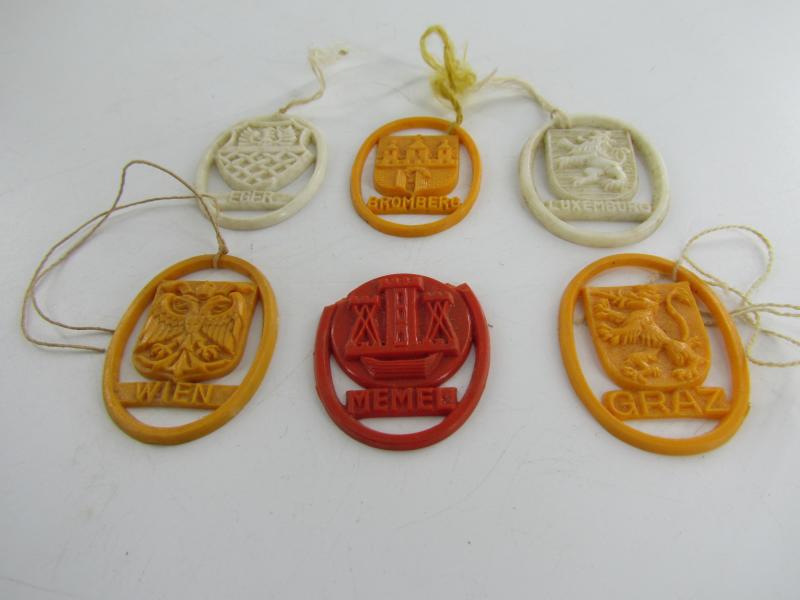 Winterhilfswerk (WHW) plastic shields of different cities of Europe.